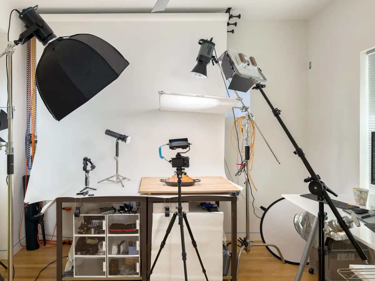 A product photography set with lights and a fabric backdrop